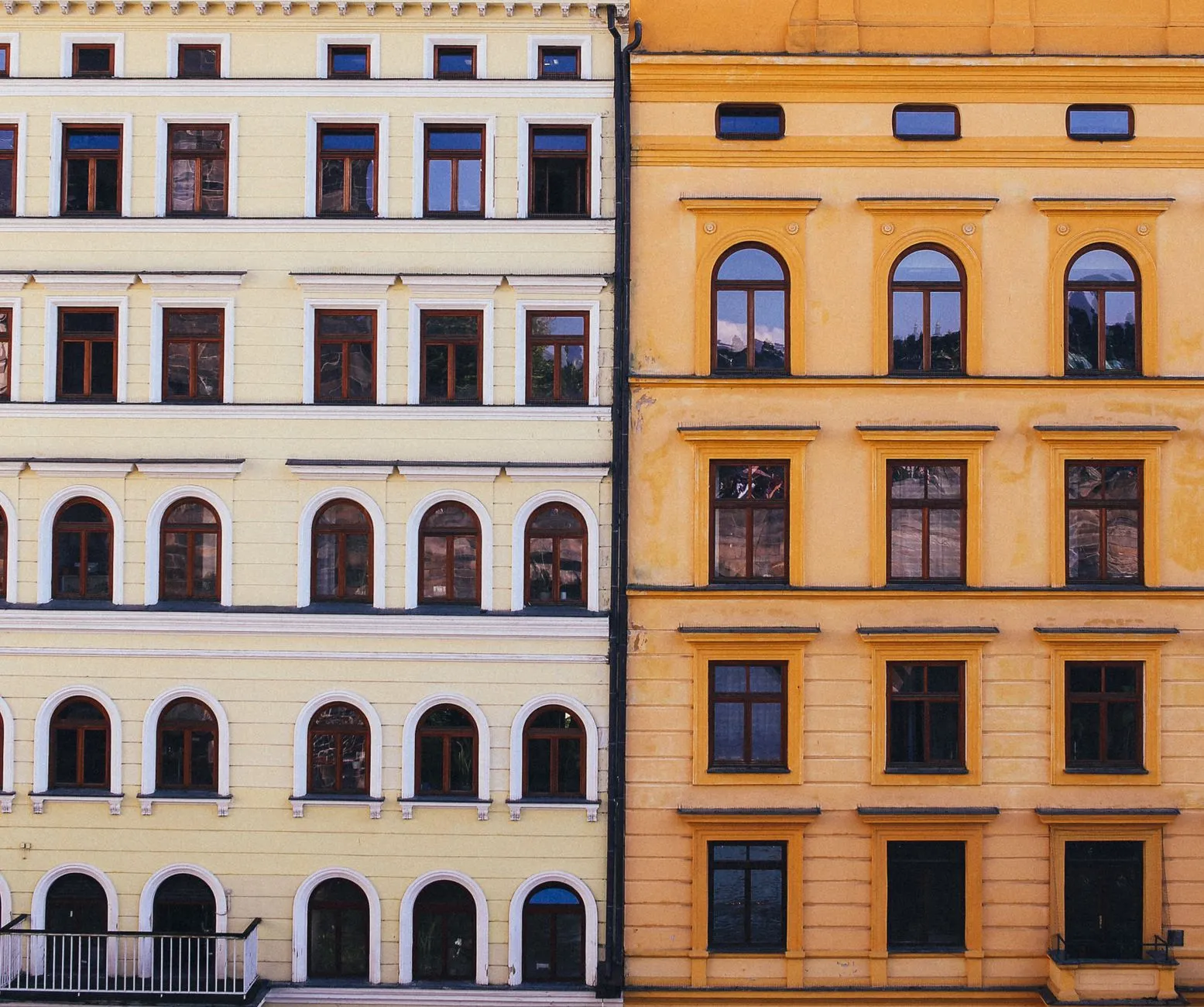 Two adjoining building facades on a city street.